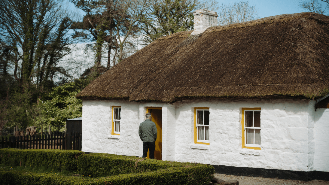 An exhibition house at Ulster Folk Museum with yellow window sills.
