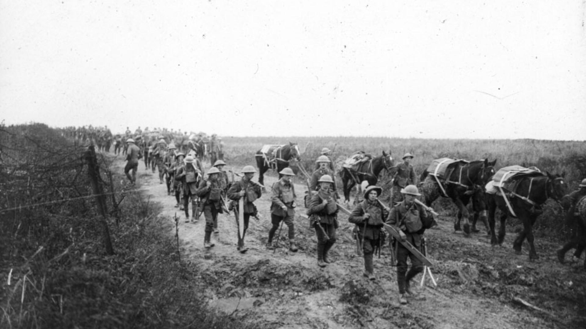 ritish soldiers marching with pack horses.