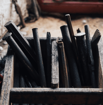 An image of a box full of chisels. 