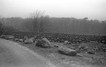 An image of a stone wall stretching into the distance.