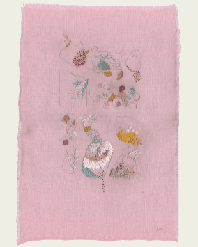 On pink linen, bright threads form shapes and patterns that refernce the sea.