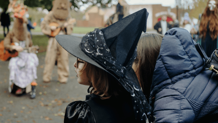 a girl with a witch hat at ulster folk museum