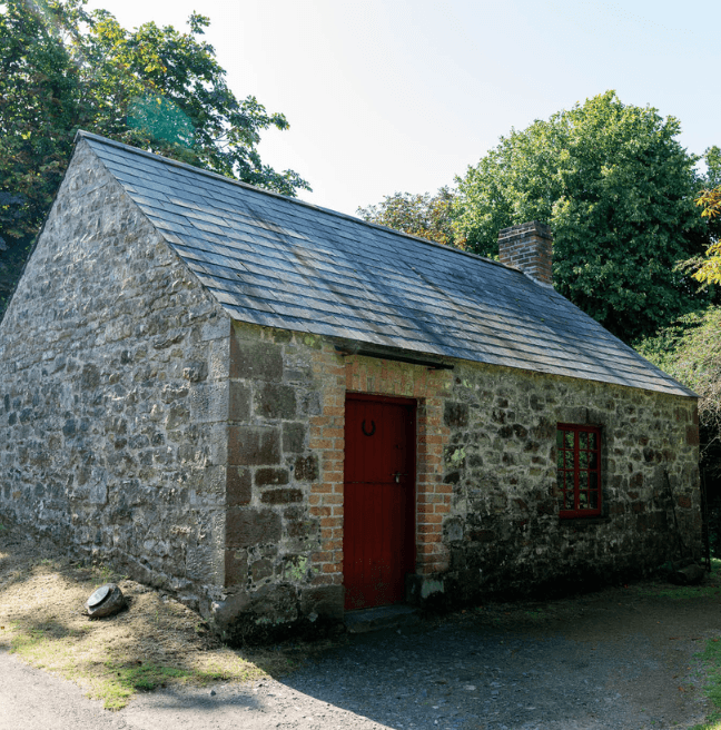 A stone building with a slate tiled roof