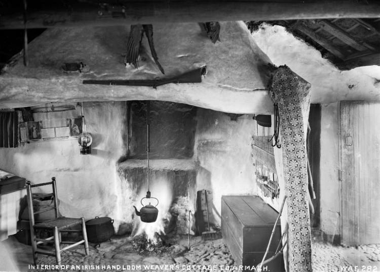 Interior of Irish handloom weaver’s cottage, black and white photograph