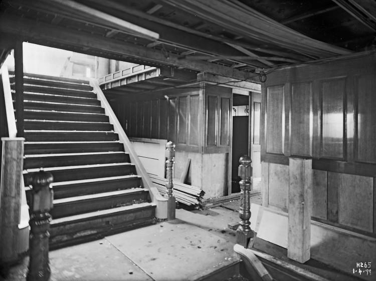 The interior of a ship during building, showing intricate joinery.