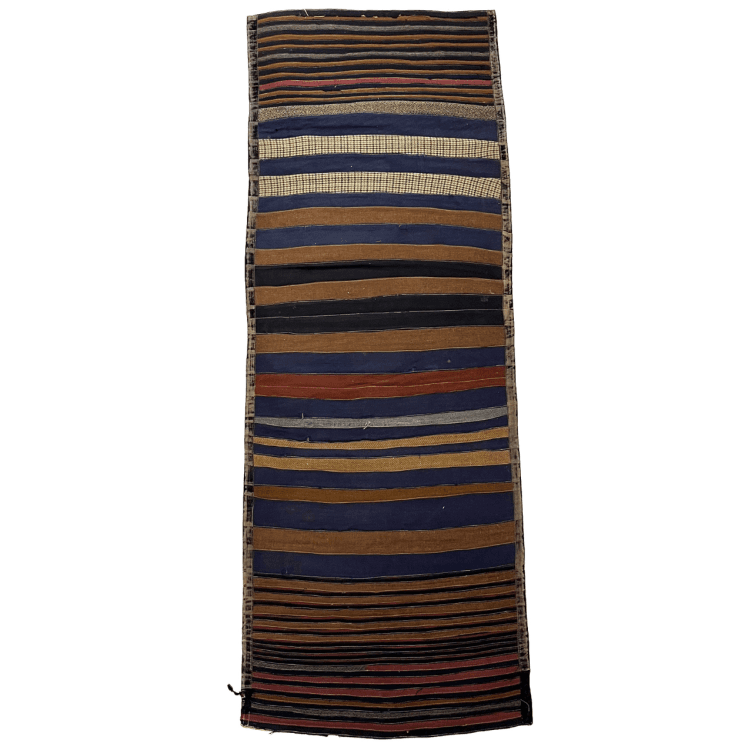 A long rug. It is a striped pattern with different colours of fabric making the stripes.