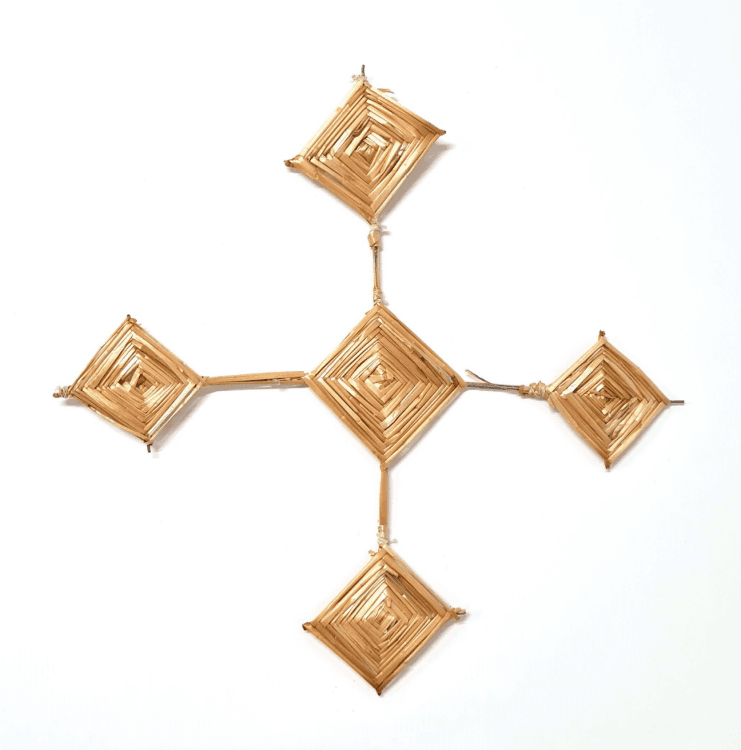 A Saint Brigid's Cross. The cross has a diamond centre with four legs of equal length that end in diamond shapes the same size as the centre diamond.