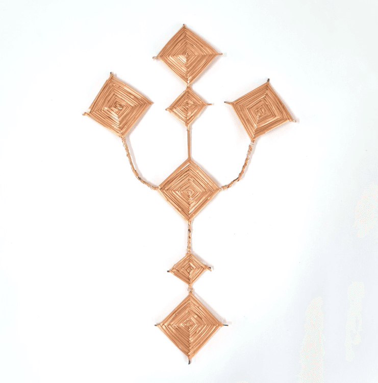 A Saint Brigid's Cross. The cross is shaped like a trident, with core areas that are shaped like diamonds.